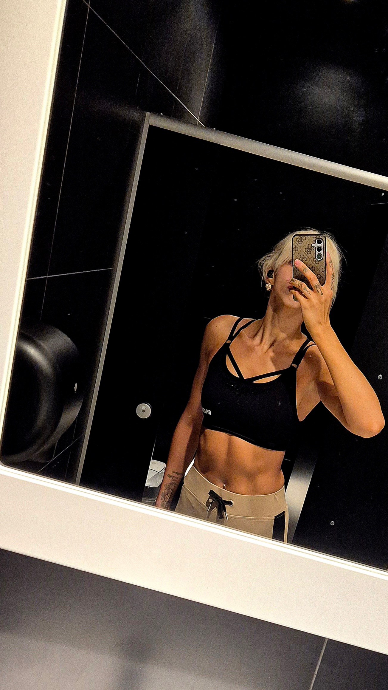 Emma in a sports bra